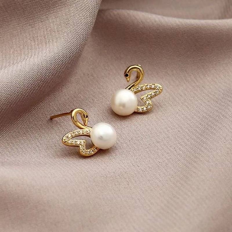Boucles d'oreilles en or cygne et diamant