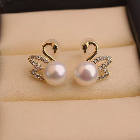 Boucles d'oreilles en or cygne et diamant