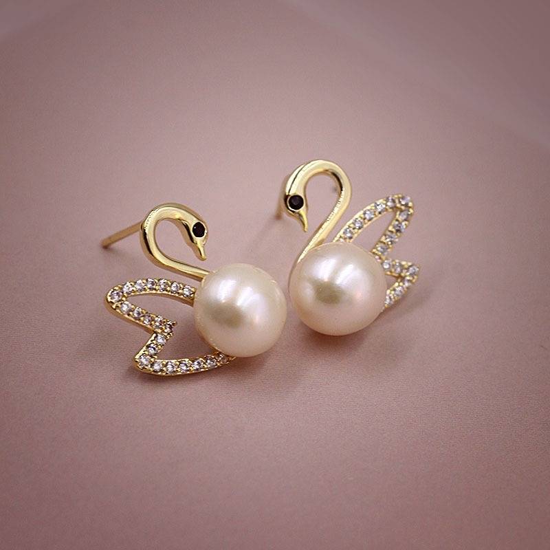 Boucles d'oreilles en or cygne et diamant