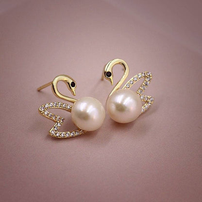 Boucles d'oreilles en or cygne et diamant