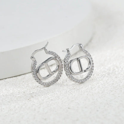 Boucles d'oreilles CD Letter – Boucles d'oreilles lettres CD ajourées