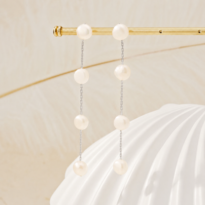 Boucles d'oreilles longues avec gouttes de perles