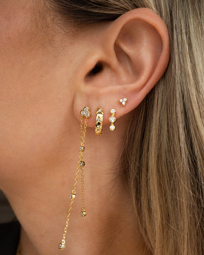 Boucles d'oreilles en forme de fleur avec trois cristaux dorés