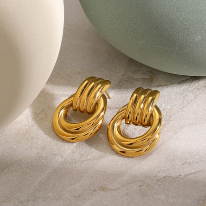 Anna – Boucles d'Oreilles Créoles Entrelacées Élégantes