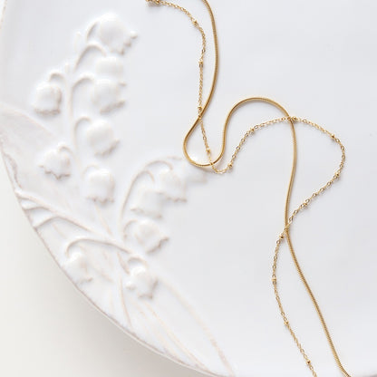 Selya – Collier Double Rang Chaîne Serpent et Perles en Or