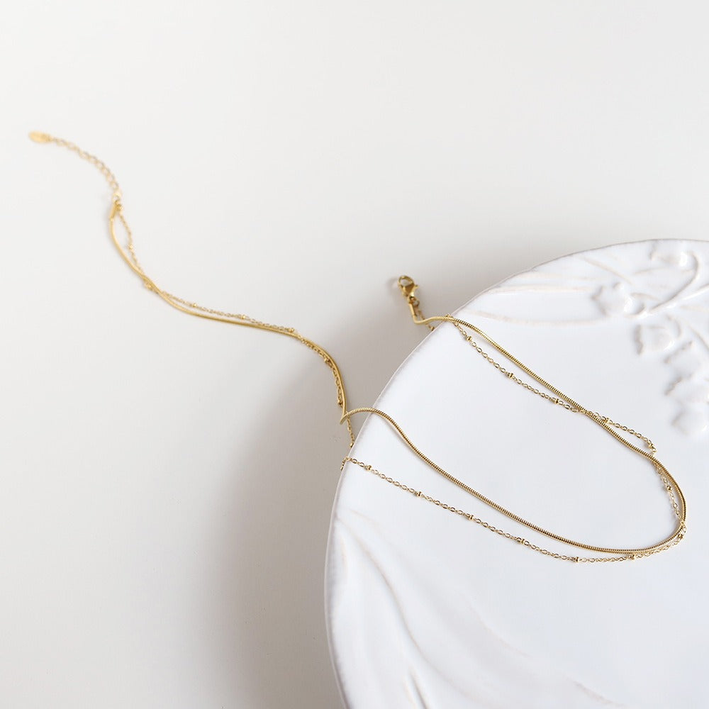 Selya – Collier Double Rang Chaîne Serpent et Perles en Or