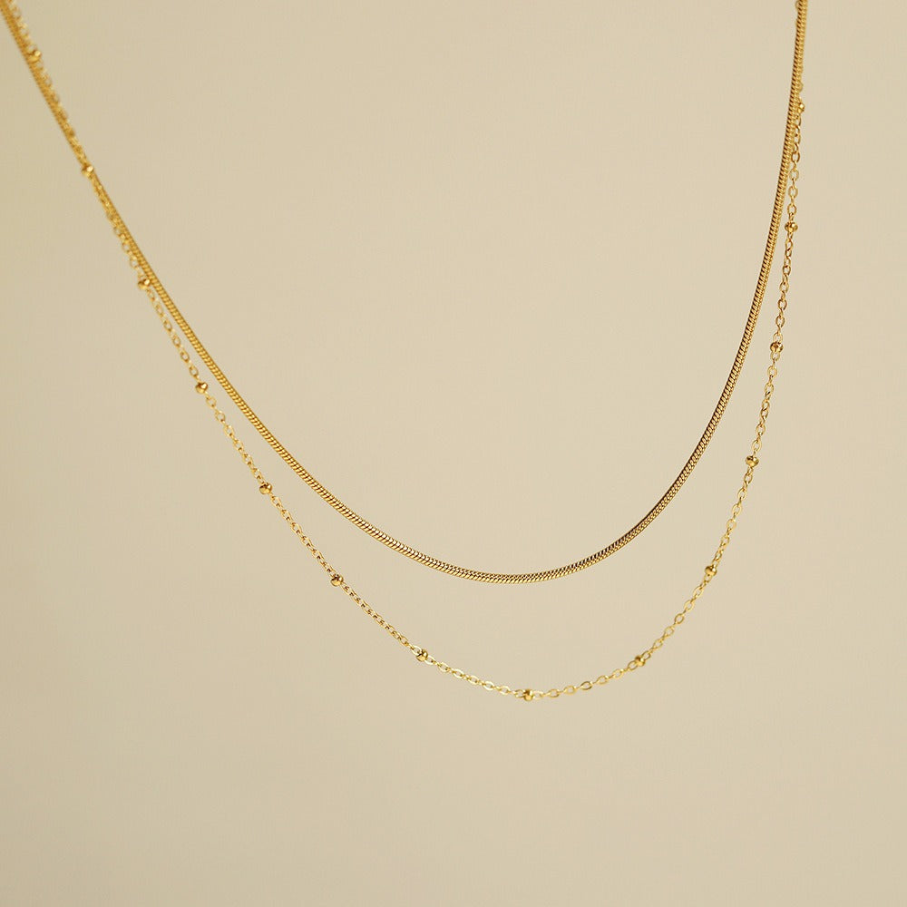 Selya – Collier Double Rang Chaîne Serpent et Perles en Or