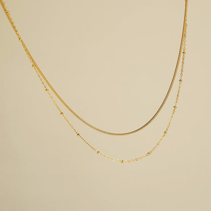 Selya – Collier Double Rang Chaîne Serpent et Perles en Or
