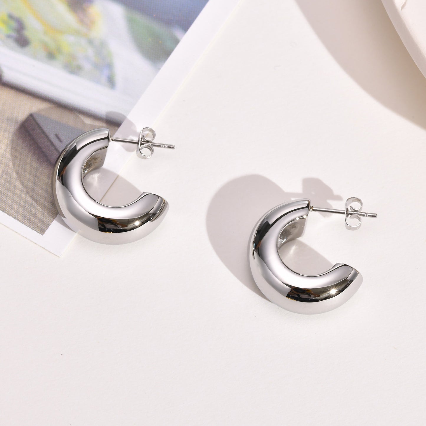 Naya – Boucles d’oreilles en acier inoxydable doré en forme C